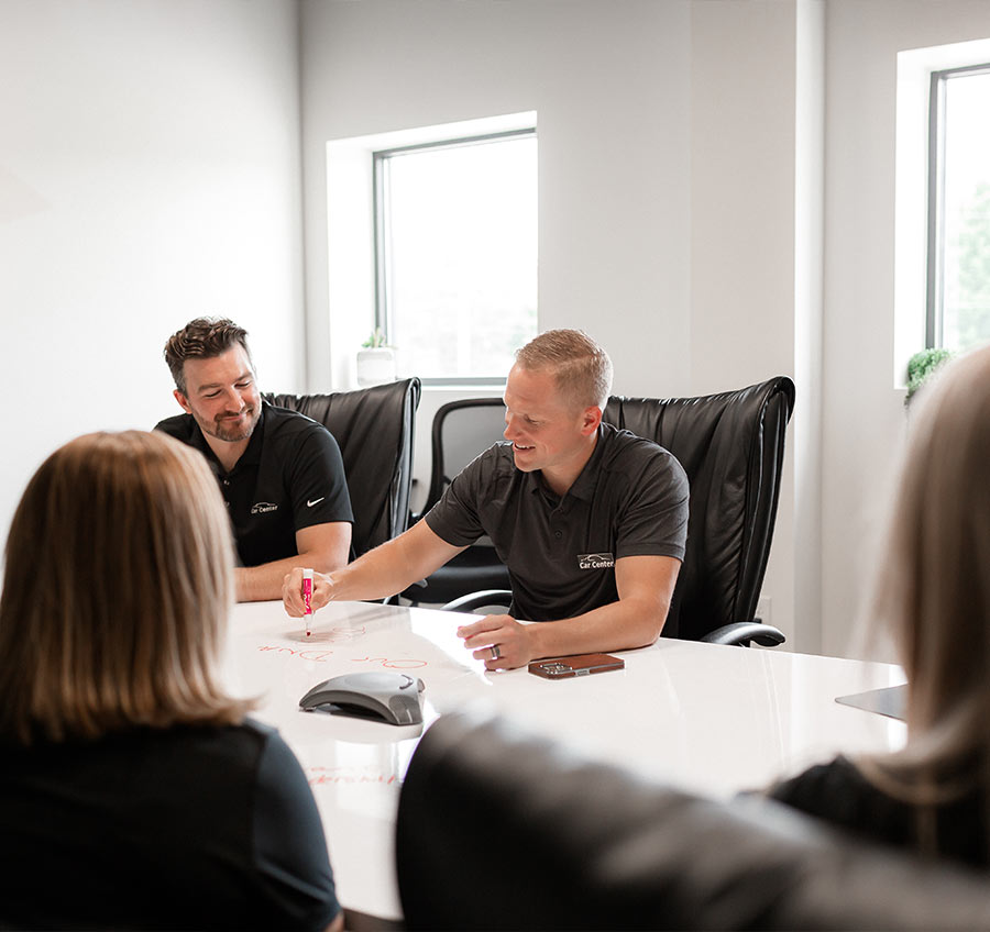 Car Center team meeting at body shop office in Michigan