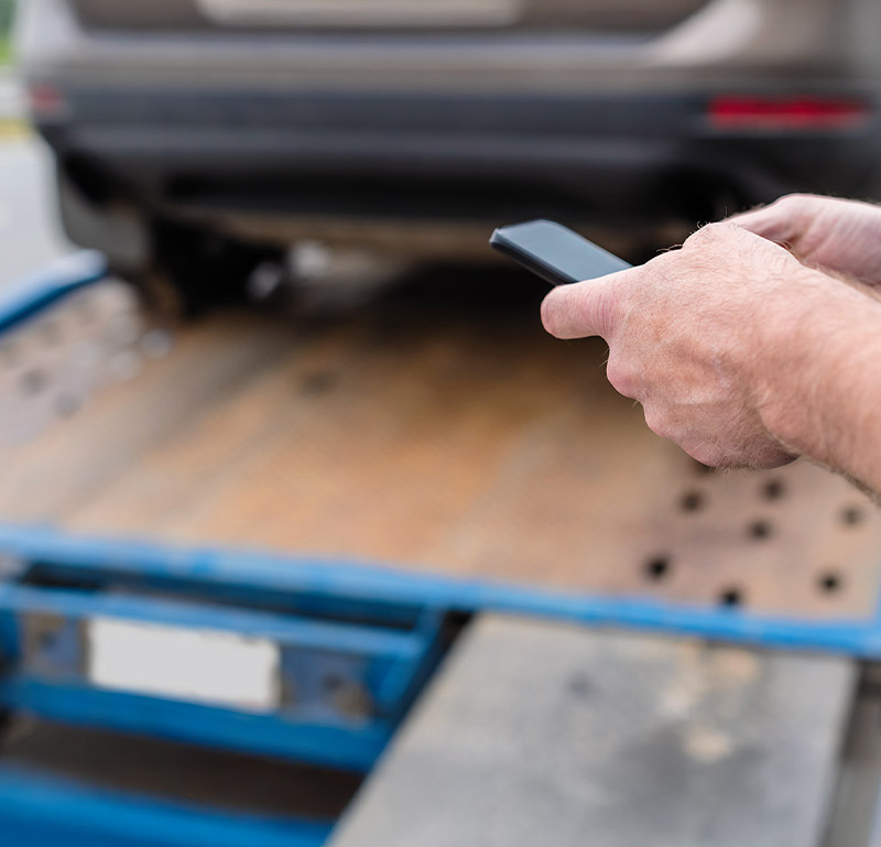 phone call with vehicle on tow truck after auto accident